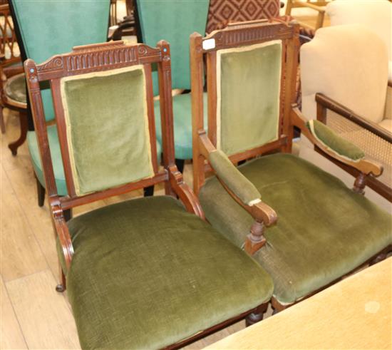 A pair of Edwardian ladies and gentlemens elbow chairs